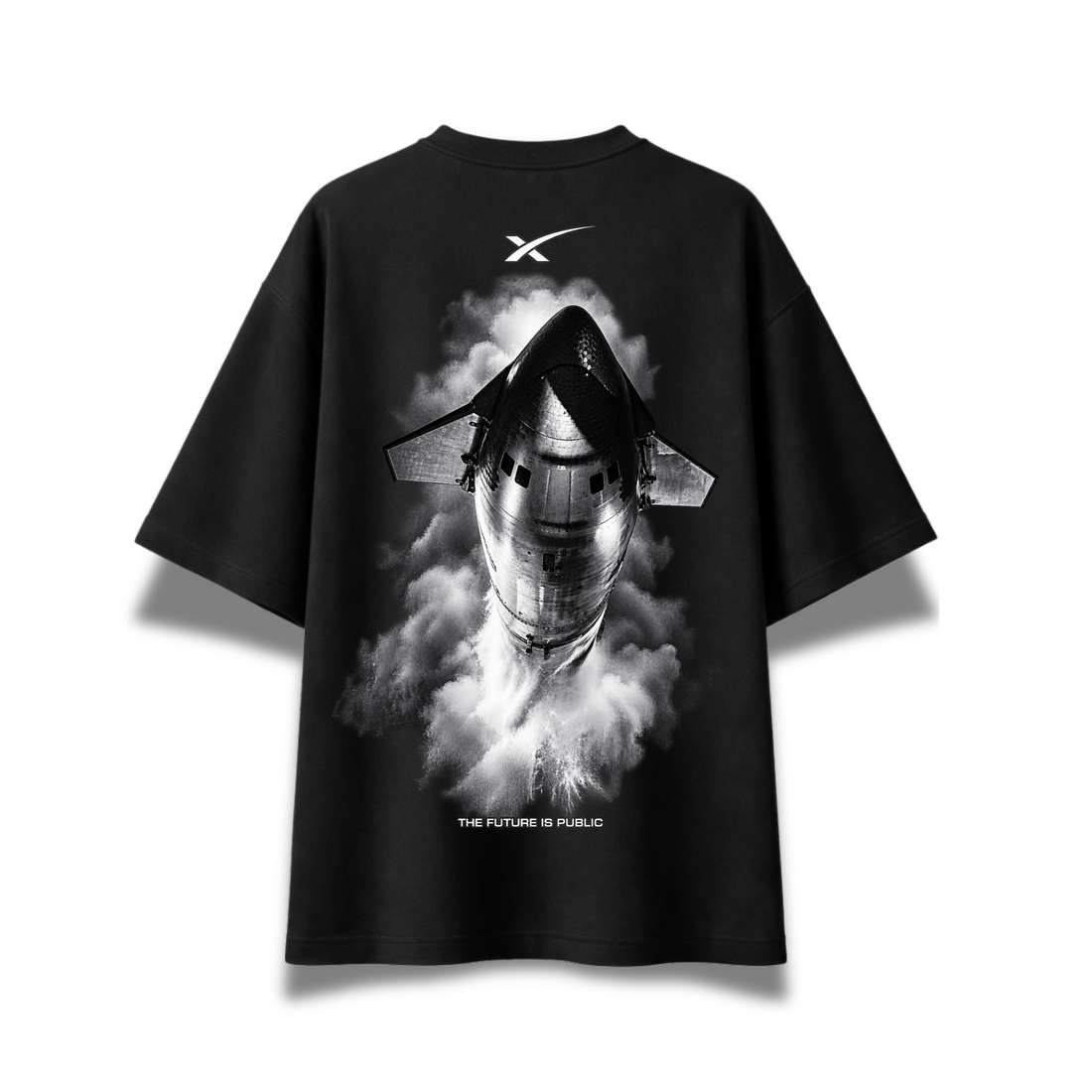 A black short-sleeve t-shirt with a large black-and-white graphic of a space shuttle emerging from smoke on the front. The shirt features a white stylized 'X' logo on the upper chest and the text 'THE FUTURE IS PUBLIC' near the bottom of the graphic, displayed against a clean white background.