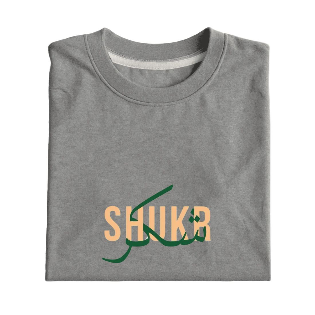 Folded gray t-shirt with 'SHUKR' text in green and orange on a light gray background