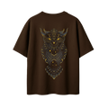A dark brown short-sleeve t-shirt with a large, detailed graphic of an owl on the back. The owl is rendered in black with intricate gold patterns and glowing yellow eyes, set against a solid white background.