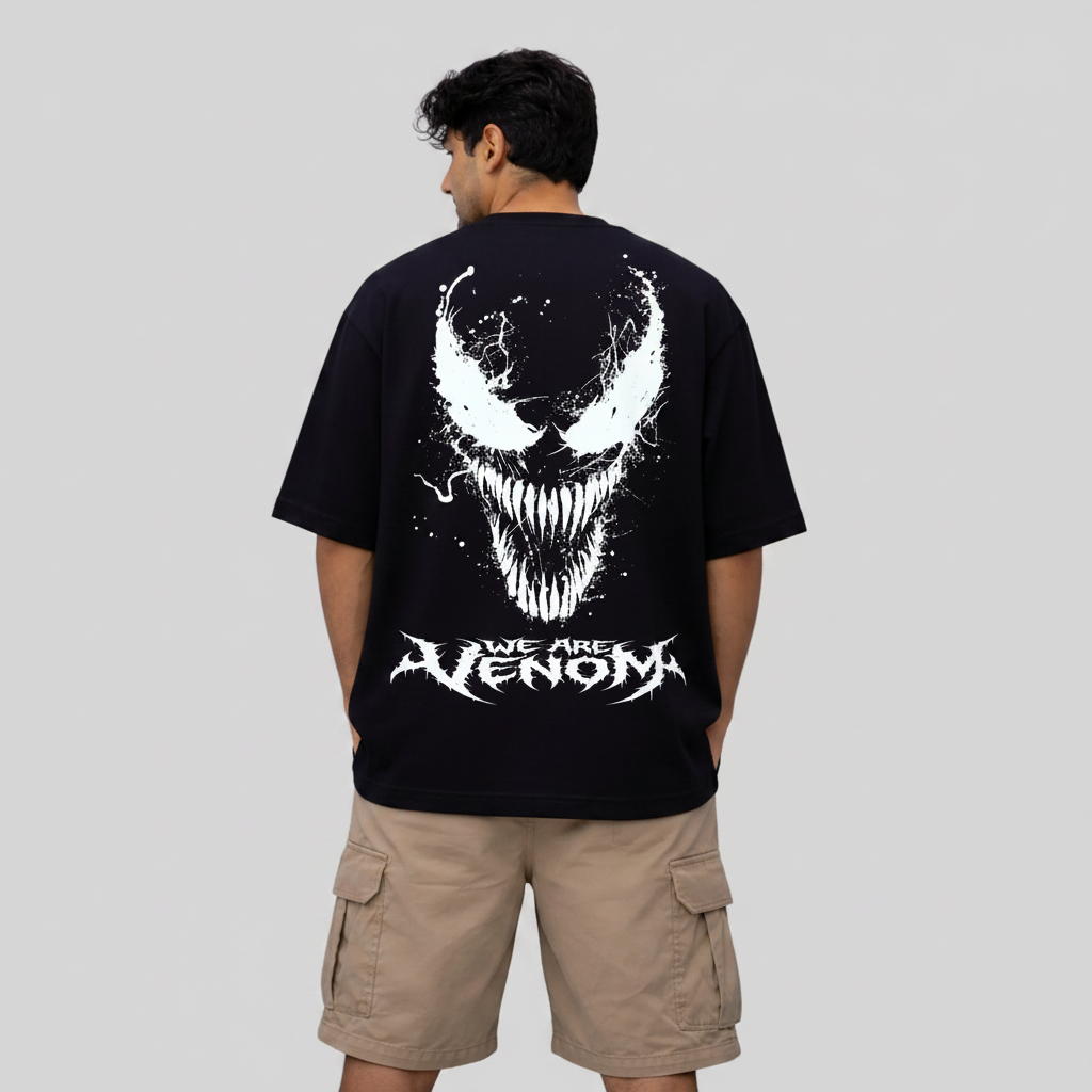 Person wearing a black t-shirt with a white graphic and text on the back, standing against a white background.