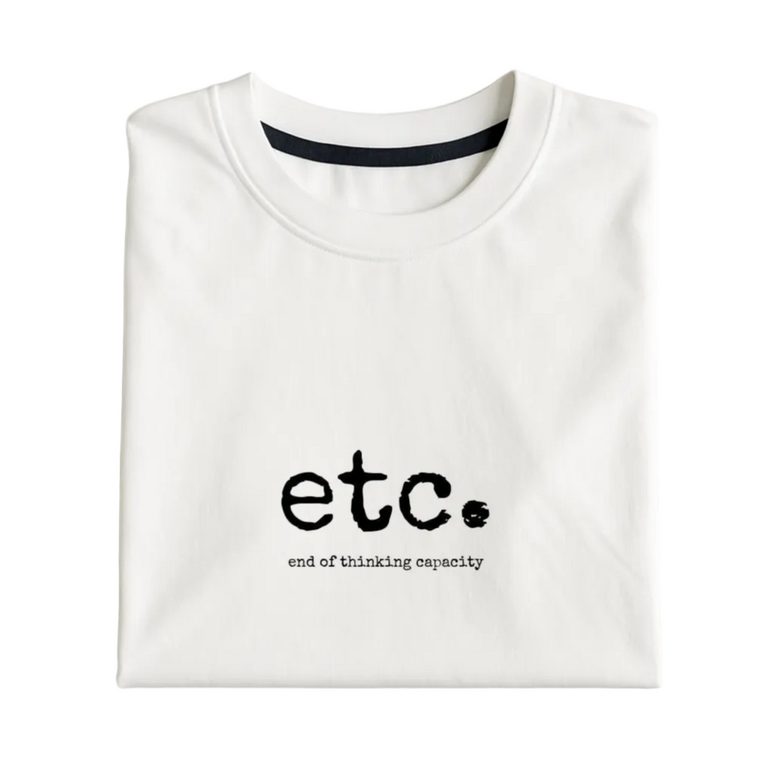 White t-shirt with 'etc. end of thinking capacity' text on a light gray background