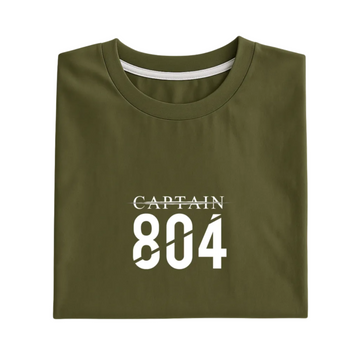 Folded green t-shirt with 'CAPTAIN 804' text on a white background