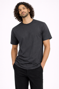 Man wearing a black t-shirt and pants on a white background