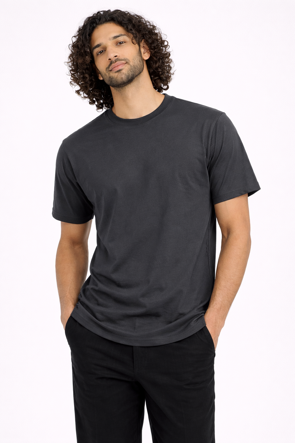Man wearing a black t-shirt and pants on a white background