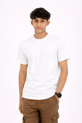Person wearing a plain white t-shirt and brown pants on a white background