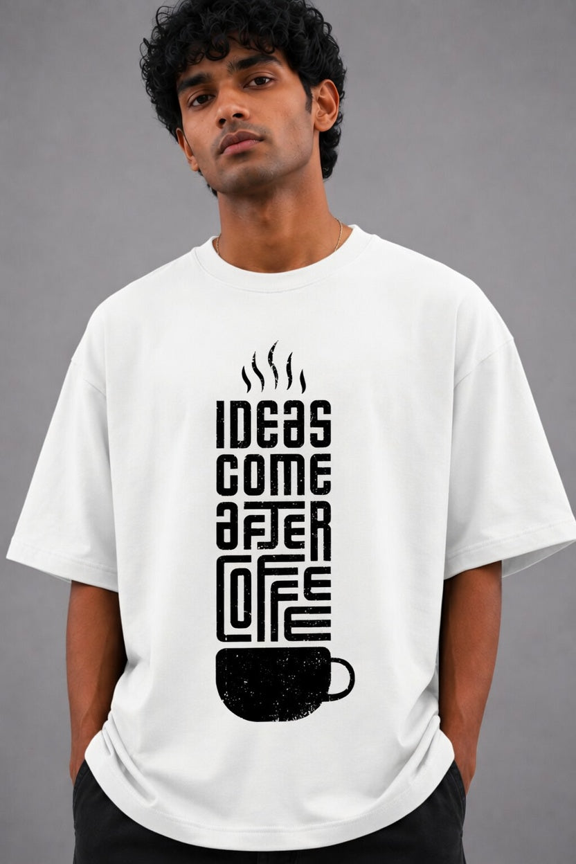 Man wearing a brown t-shirt with a coffee-themed design on a gray background